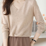 V-neck knitted sweater with hot-fixed rhinestones.