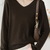 V-neck knitted sweater with hot-fixed rhinestones.