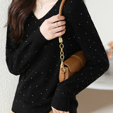 V-neck knitted sweater with hot-fixed rhinestones.