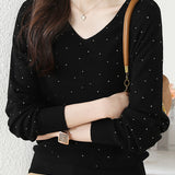 V-neck knitted sweater with hot-fixed rhinestones.