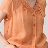 Casual V-neck gathered loose shirt.