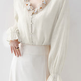 Elegant Lace Floral Flare‑Sleeve V‑Neck Blouse