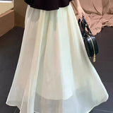 Elegant Mature Two-Piece Set: Sleeveless Top & Black-White Midi Skirt