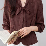 French Commuter V‑Neck Long‑Sleeve Blouse With Tie Detail And Polka‑Dot Print