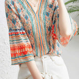 V-neck bell sleeve printed top