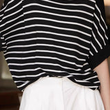 Versatile loose-fit striped short-sleeve knit top.