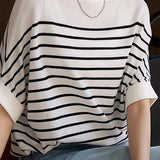 Versatile loose-fit striped short-sleeve knit top.