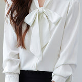 Elegant office-ready bow-tie blouse