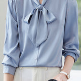 Elegant office-ready bow-tie blouse