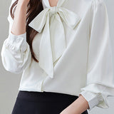 Elegant office-ready bow-tie blouse