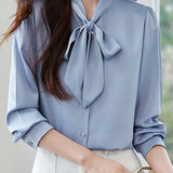 Elegant office-ready bow-tie blouse