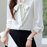 Elegant office-ready bow-tie blouse