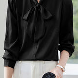 Elegant office-ready bow-tie blouse