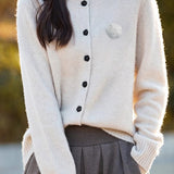 Elegant Round-neck Cardigan with 3D Floral Knit Details