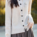 Elegant Round-neck Cardigan with 3D Floral Knit Details