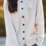 Elegant Round-neck Cardigan with 3D Floral Knit Details