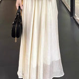 Elegant Mature Two-Piece Set: Sleeveless Top & Black-White Midi Skirt