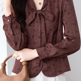 French Commuter V‑Neck Long‑Sleeve Blouse With Tie Detail And Polka‑Dot Print
