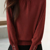 Elegant Knit Sweater With Ruffled Mock Neck And Bead Embellishment