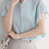 Round neck solid color ruffled shirt