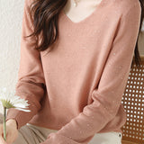 V-neck knitted sweater with hot-fixed rhinestones.