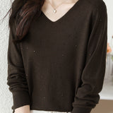 V-neck knitted sweater with hot-fixed rhinestones.
