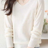 V-neck knitted sweater with hot-fixed rhinestones.