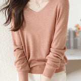 V-neck knitted sweater with hot-fixed rhinestones.