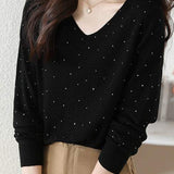 V-neck knitted sweater with hot-fixed rhinestones.